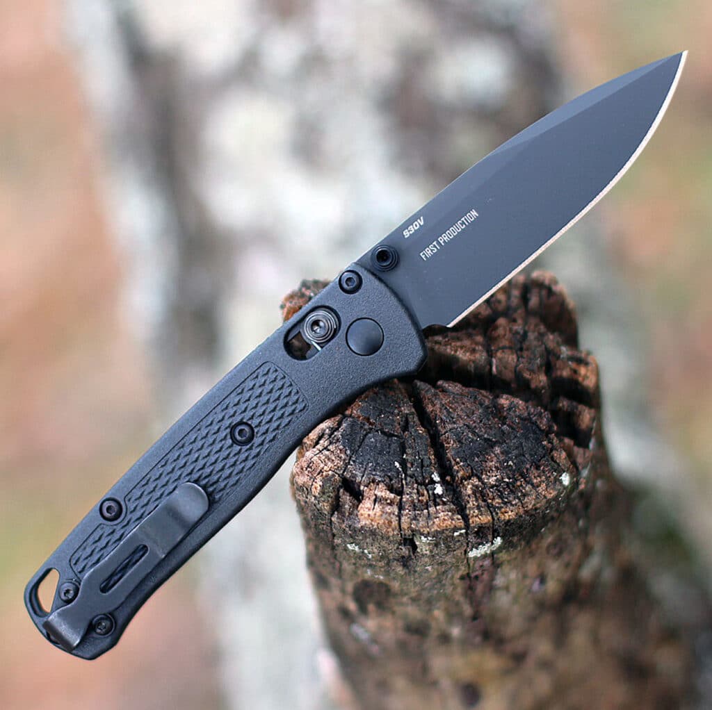 A view of a Benchmade Bugout knife on a log