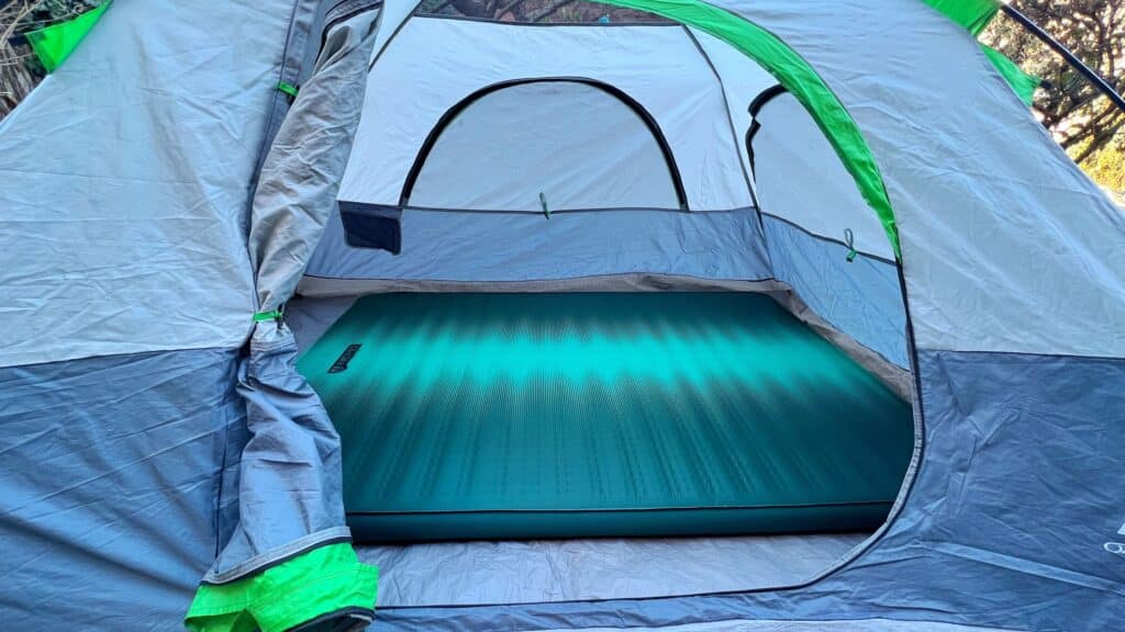 A view of a blue nemo roamer air mattress inside a tent