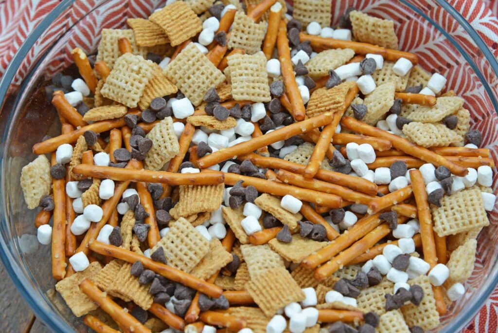 A view of a bowl of trail mix with marshmallows and chocolate chips