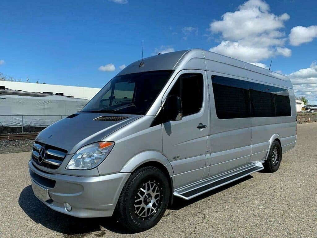 A view of a silver Mercedes Benz Luxury Camper Van on road