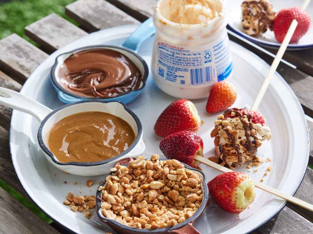 A view of a tray consisiting of strawberries and peanut butter