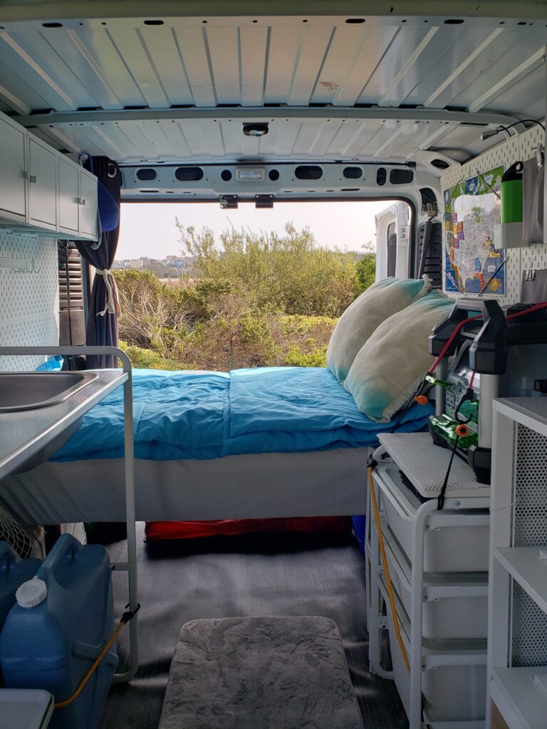 A view of bed storage inside a camper van