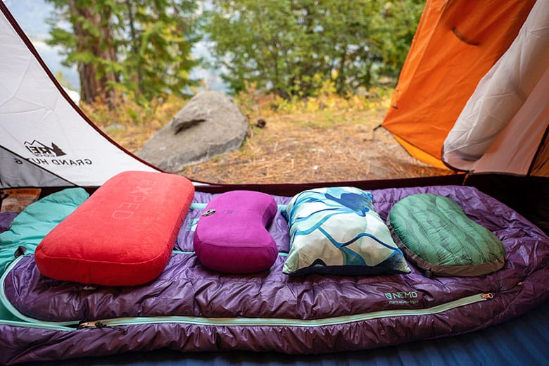 A view of various kinds of sleeping pillows inside camping tent opened