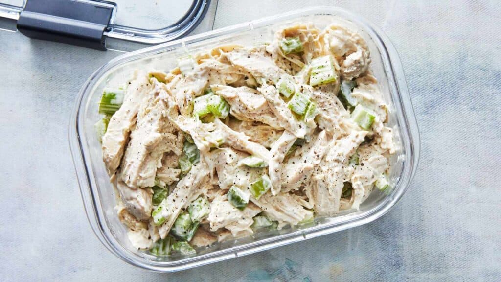 An overhead view of a creamy chicken salad in a bowl