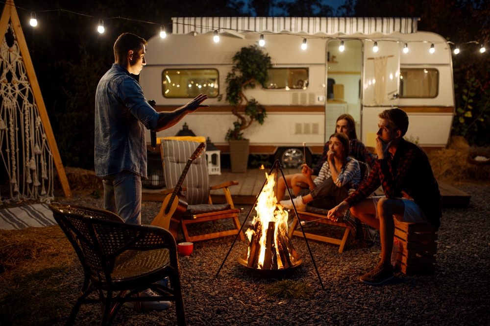 a man telling a story around campfire