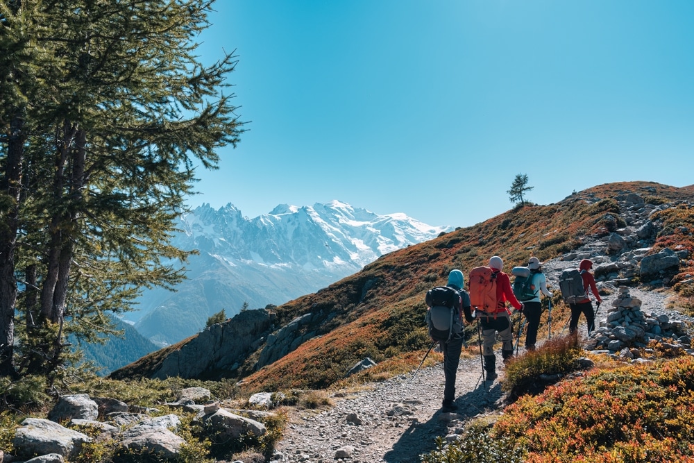 Group Of Hikers Hiking On Summit Trail To Lac Blanc