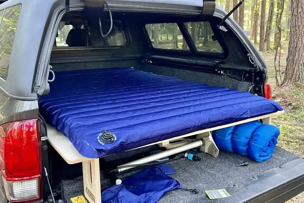 blue mattress in a truck bed