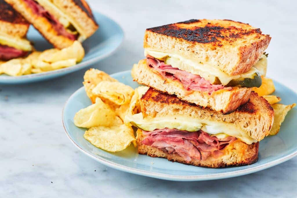 pieces of ham and cheese sandwich in a plate