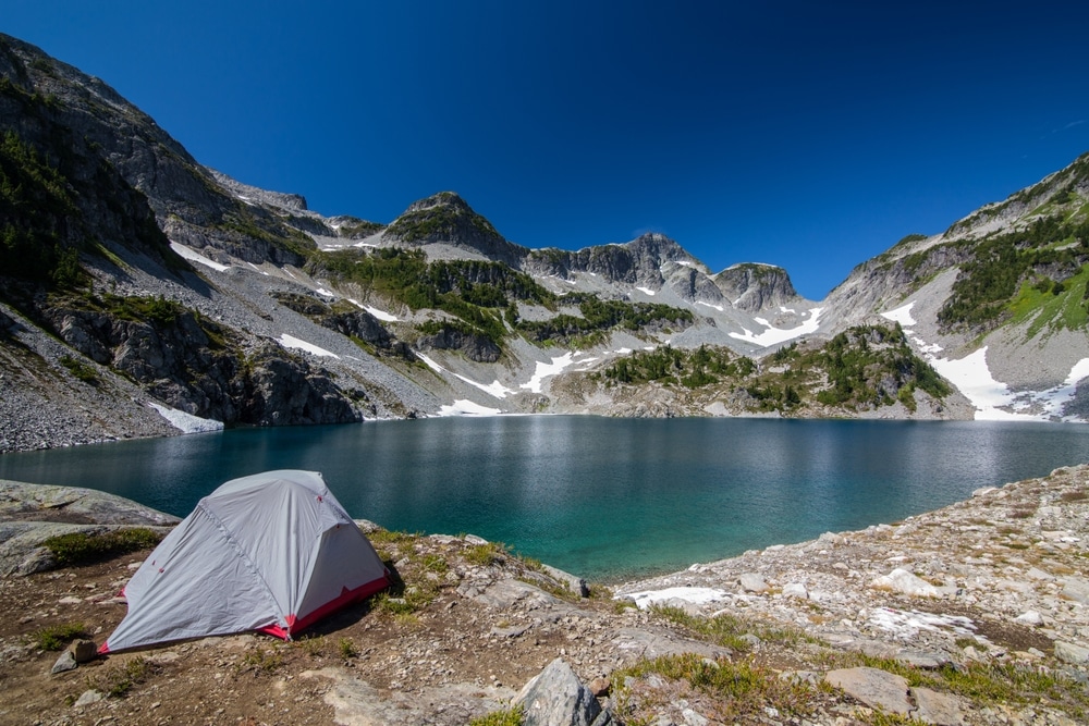 sunny day and a camping tent on the ground