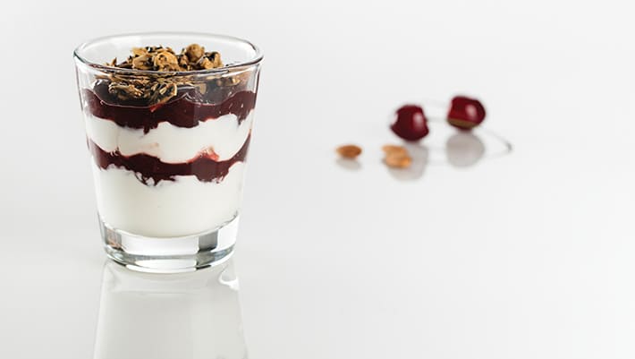 yogurt parfait trail mix in a small glass