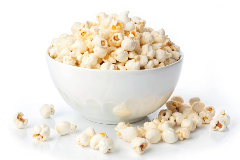 A Bowl Of Delicious Movie Popcorn Isolated On White Background