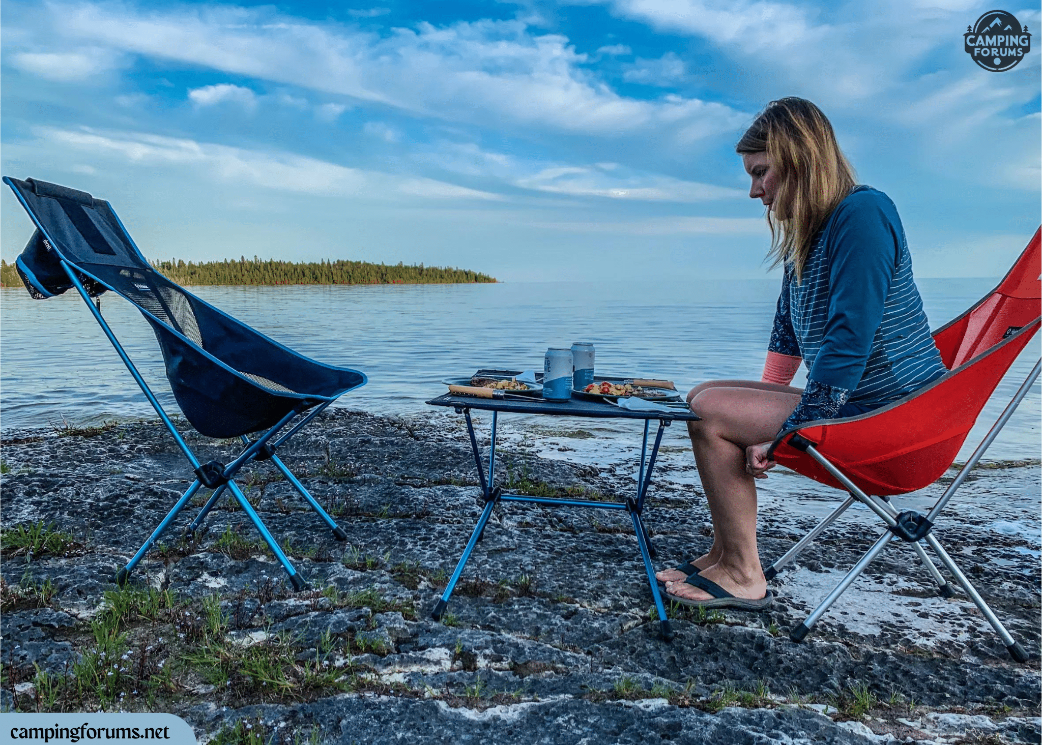 a woman sitting on a chair and Helinox Table One on side