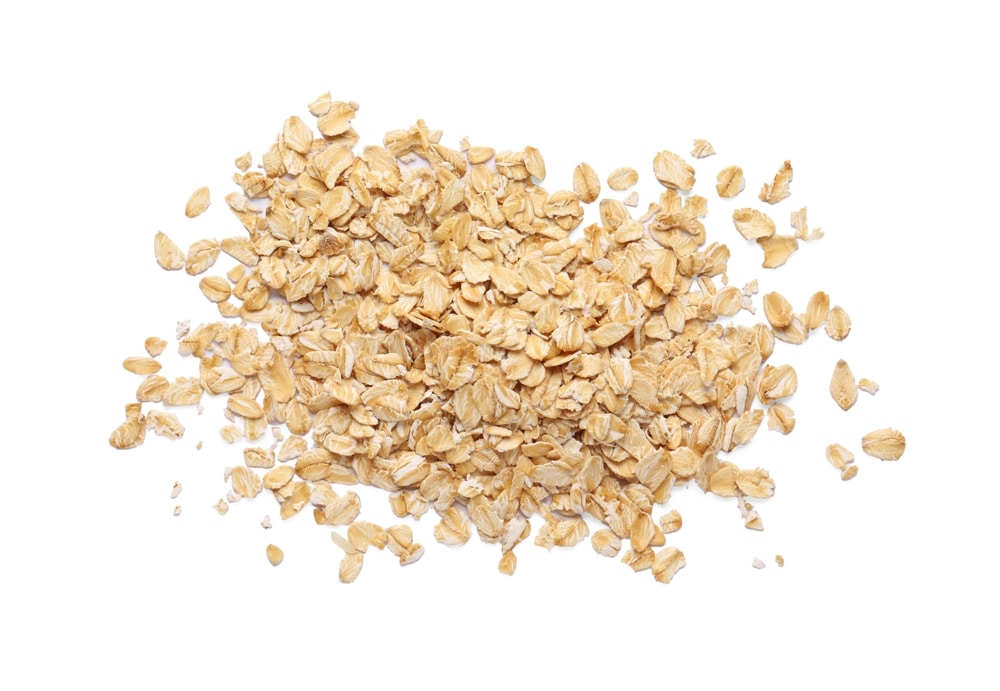 Pile Of Rolled Oats Isolated On White Top View